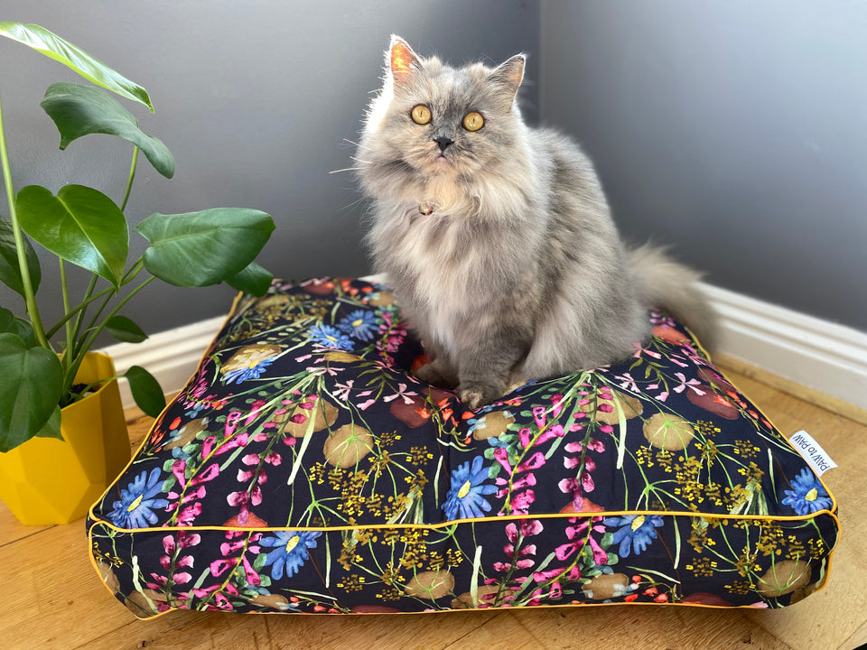 Pet bed. Navy base with watercolour wild meadow flowers, with mustard trim